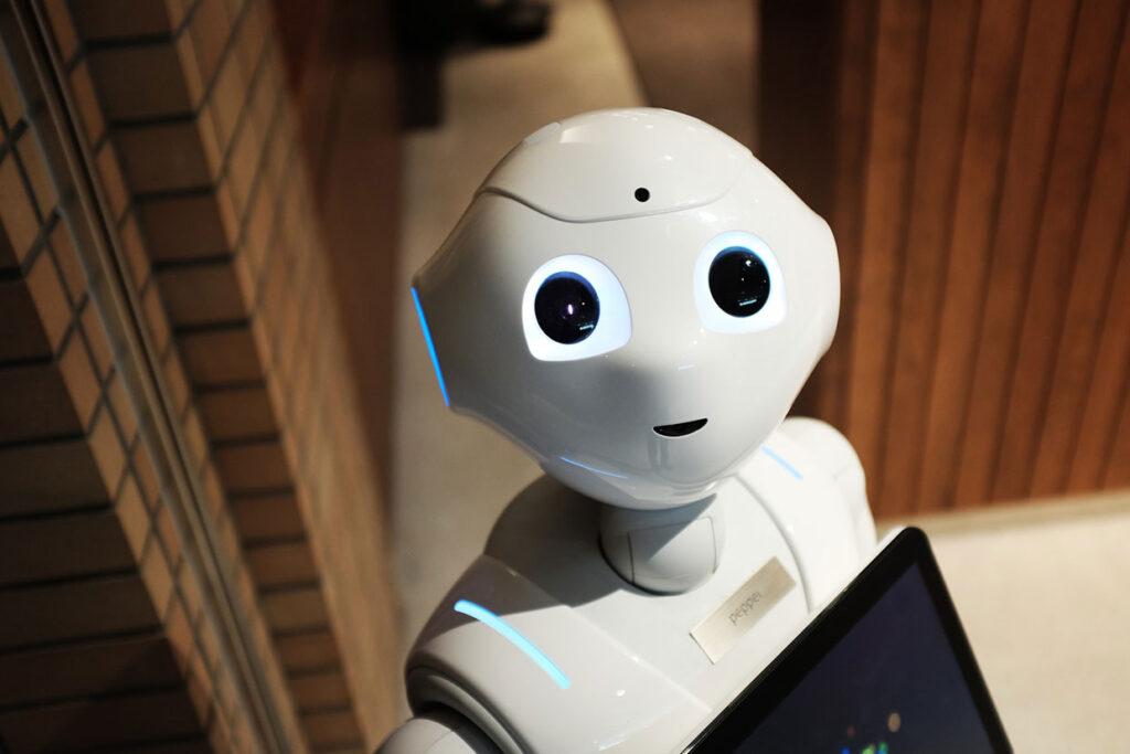 White robot stand-in for Mallory Smith, executive producer at Obscurix